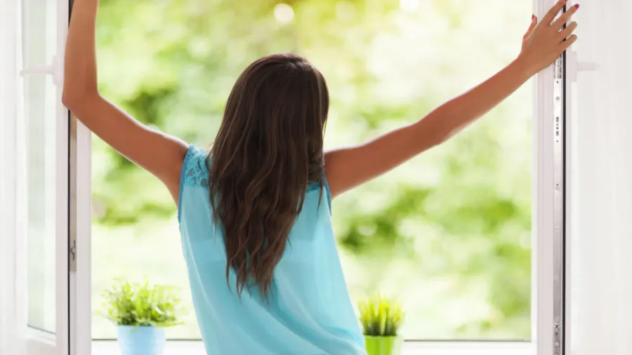 young woman breathing fresh air