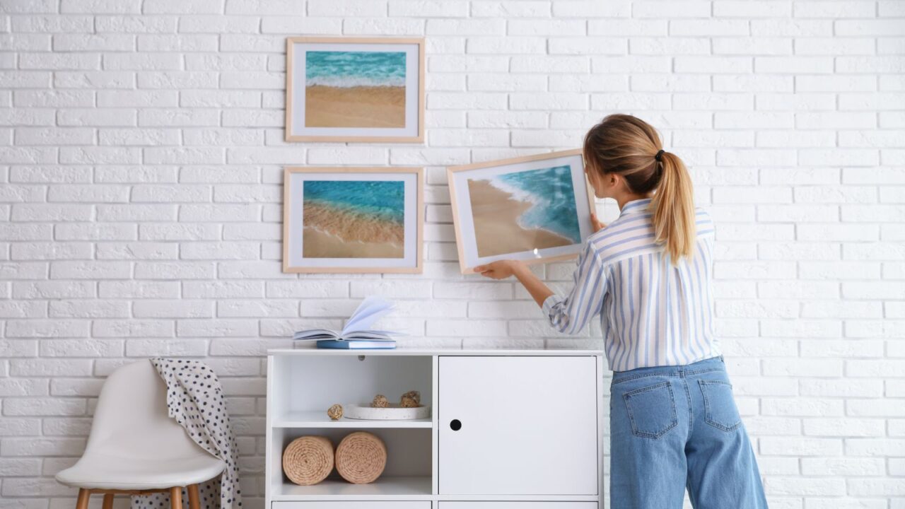 A girl decorating a wall