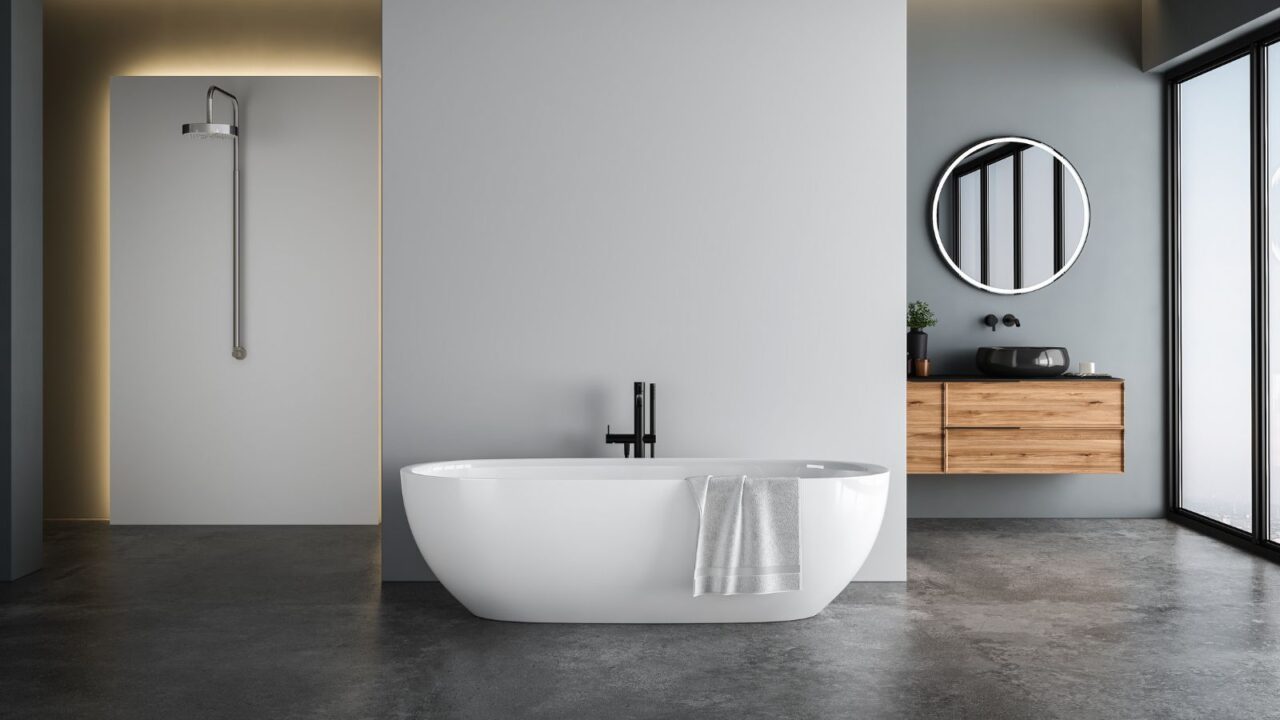 A contemporary bathroom featuring a freestanding oval bathtub, a wooden vanity with a circular mirror above it, and a shower stall with a glass door.