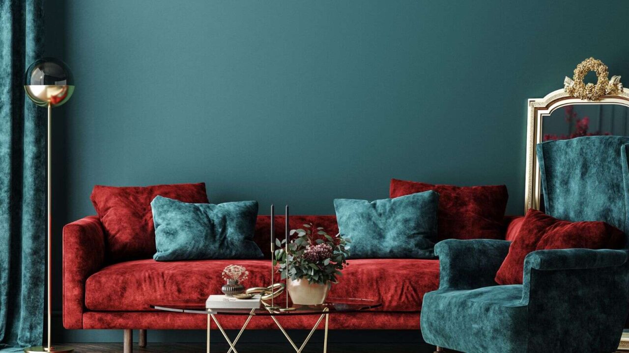 Velvet sofas in maroon and teal color