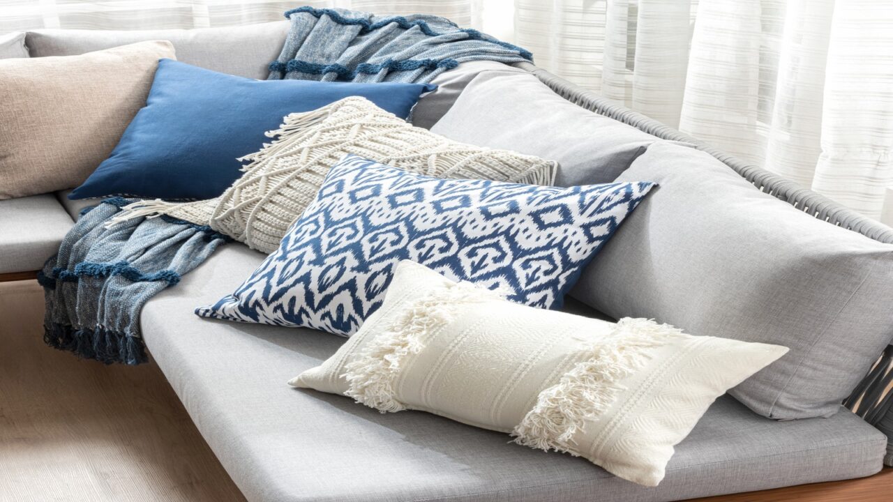 Couch with pillows, cushions, and throw