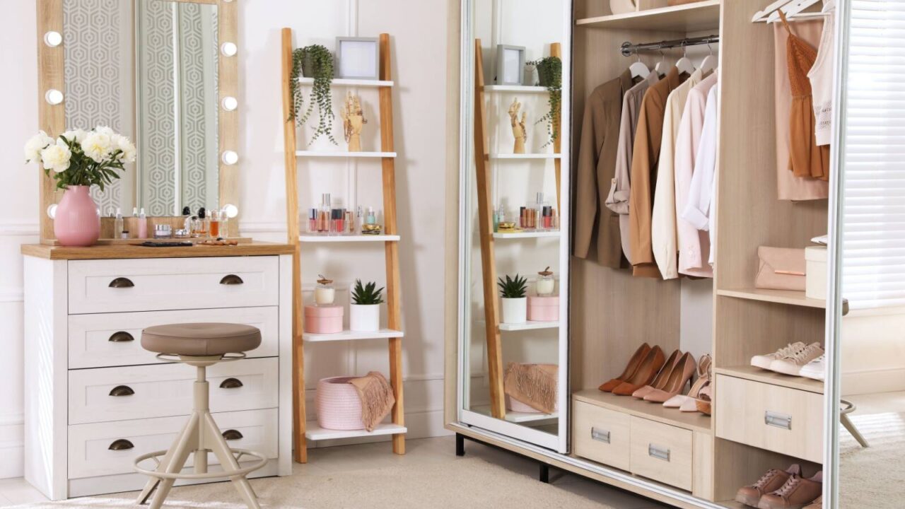 Dressing room interior with elegant dressing table, wardrobe, and floating shelves with make up accessories