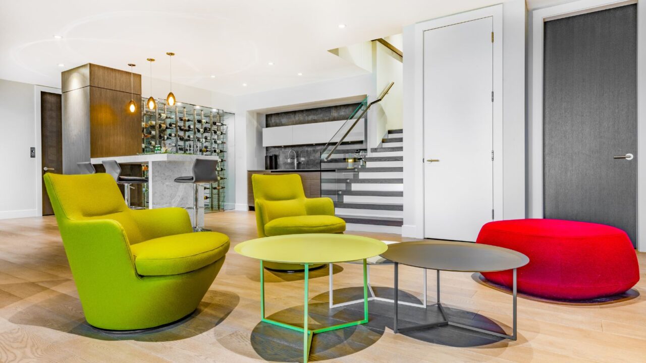 Relaxing with colourful chairs, pool table, fireplace, tv and bar