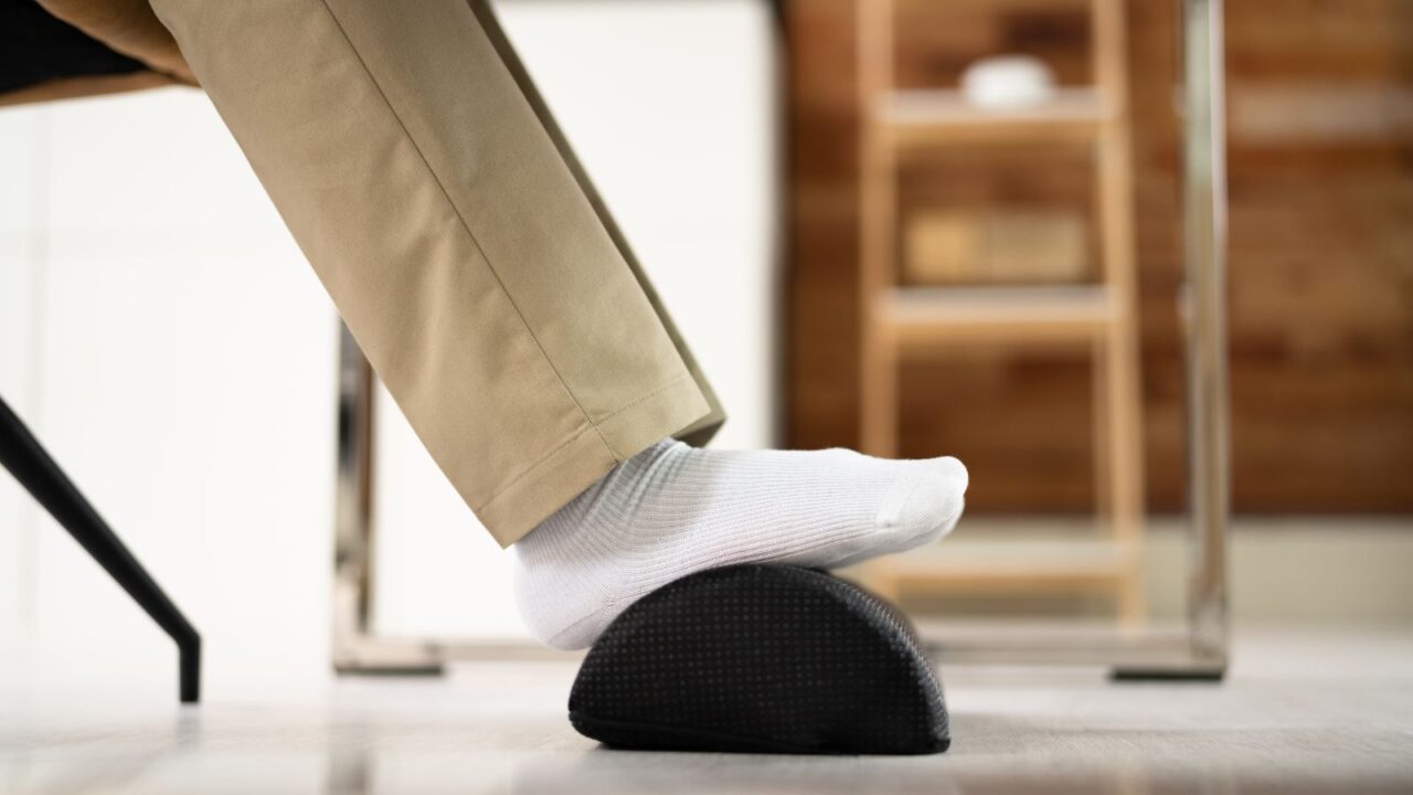 Footrest Against Pain In Office. Shifting Posture And Positions