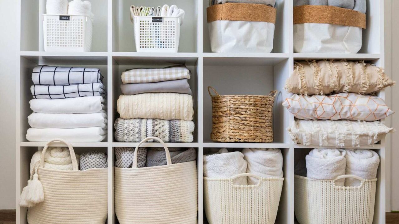 Extra household items such as pillows, towels, blankets stored in shelves in a tidy way