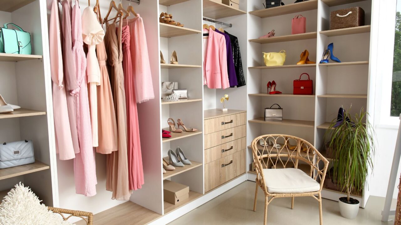 Interior of wardrobe with dresses, shoes and bags