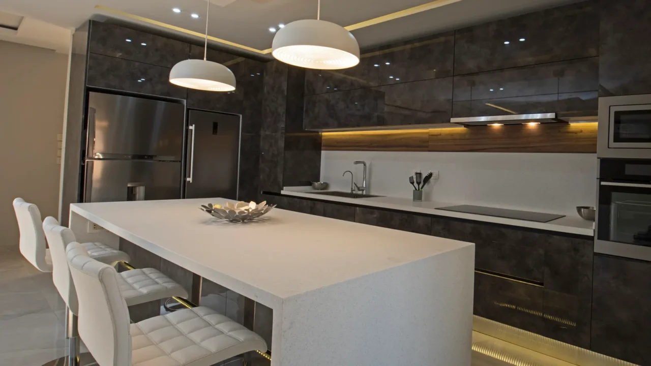 Interior design decor showing modern kitchen with cupboards in luxury apartment showroom