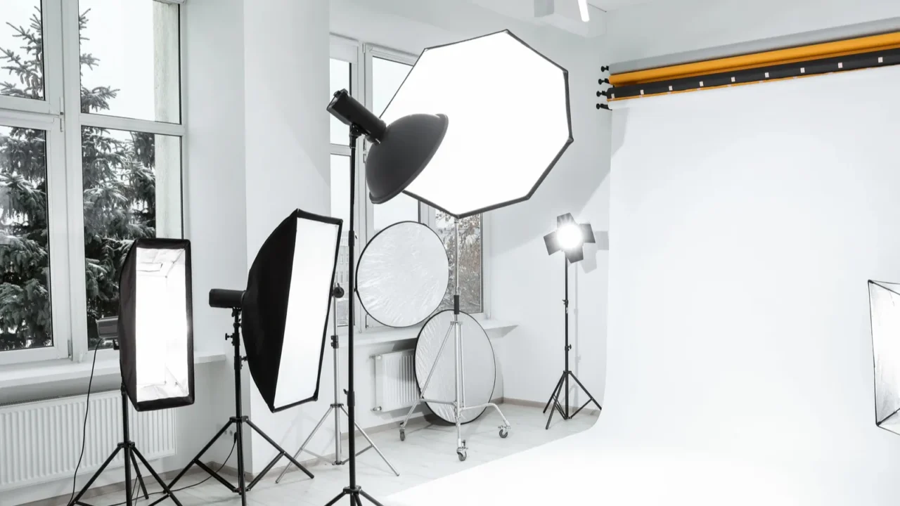 Interior of modern photo studio with professional lighting equipment