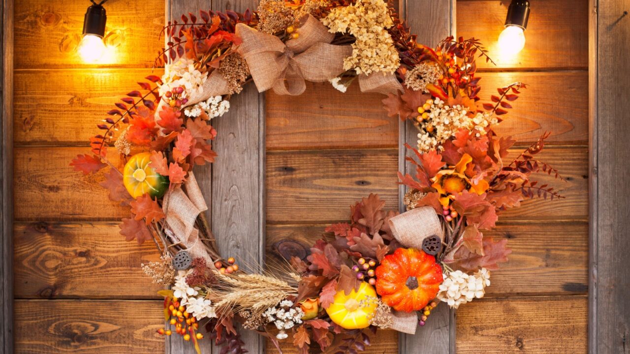 Farmhouse wreath with burlap, pumpkins, and leaves