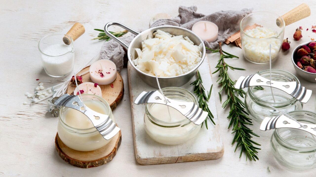 Set for homemade natural eco soy wax candles on white background. Making diy candles. Top view. Panorama with copy space.