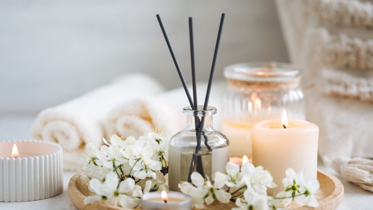 Reed diffuser, candle and fresh flowers