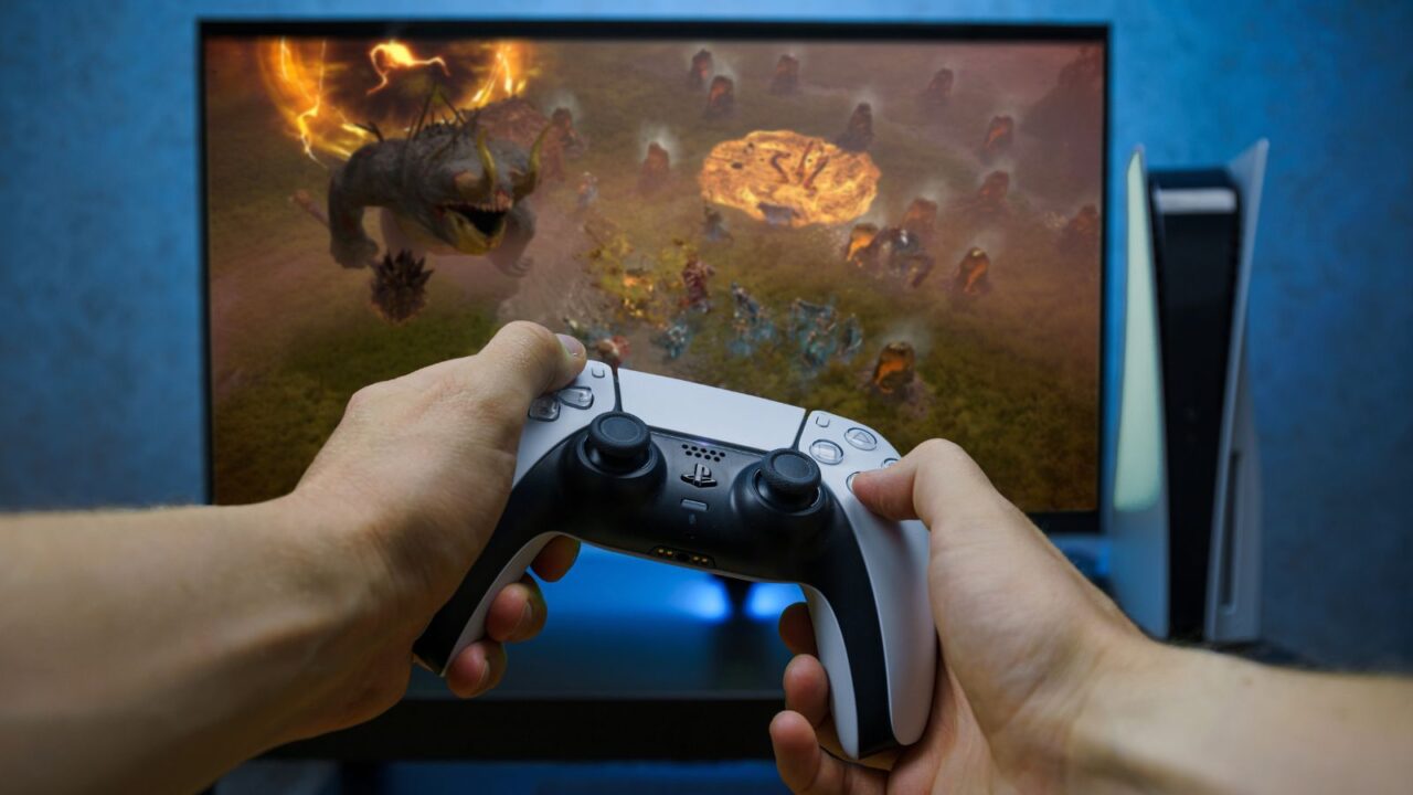 A man playing game on Playstation 5.