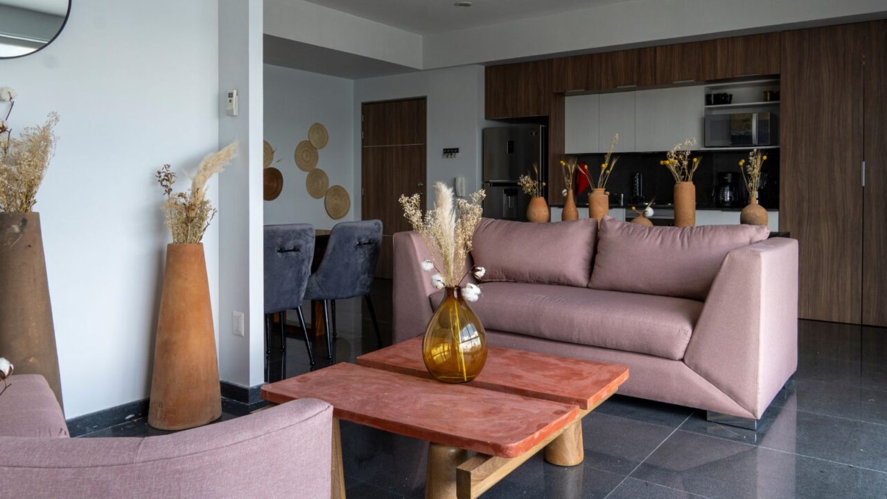 An elegant living room interior with terracotta colored furniture and decor accents.