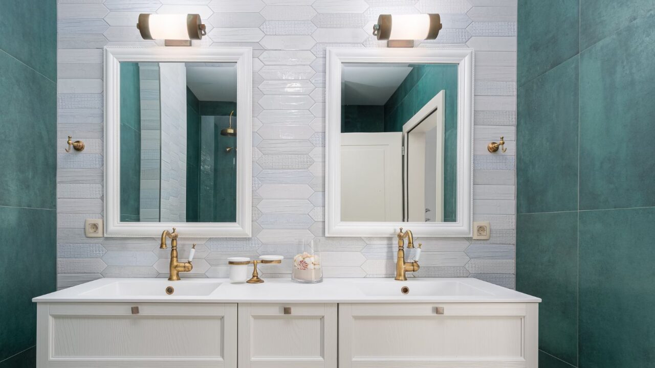 Bathroom vanity with double sink and faucets