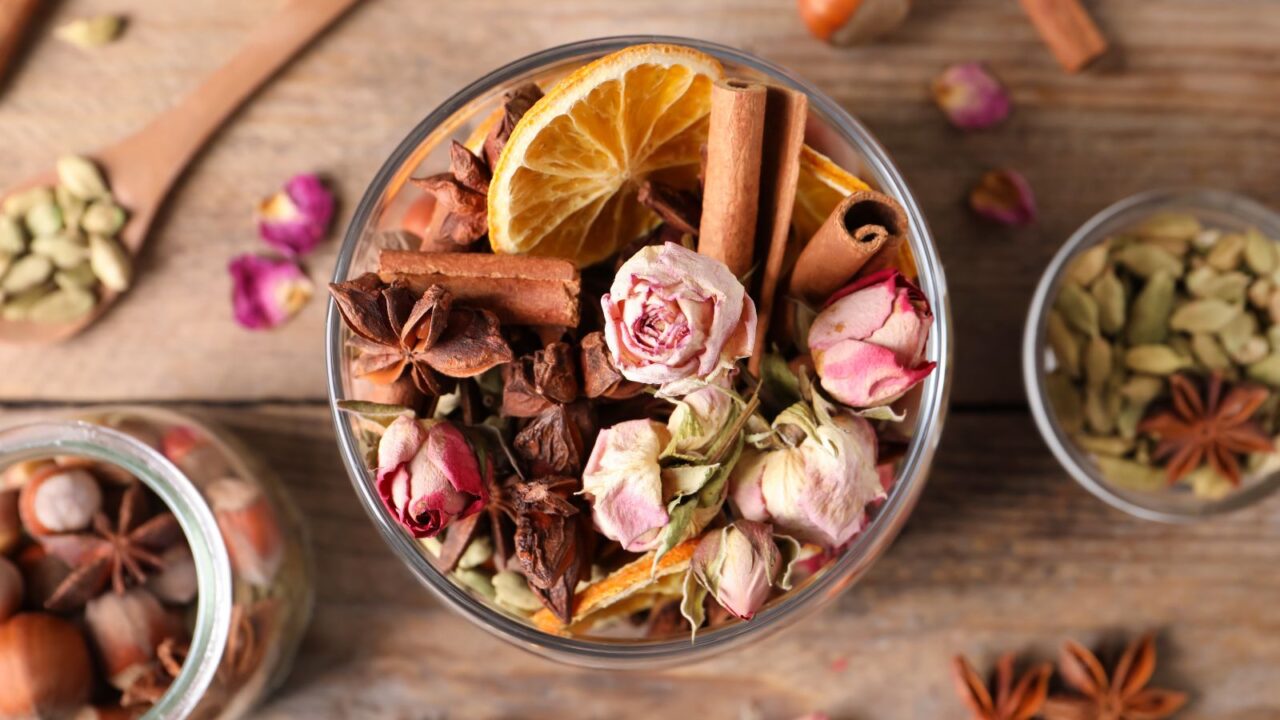 Aroma potpourri with different spices on wooden table