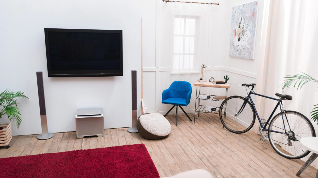 Interior of the living room with TV screen and sound speakers