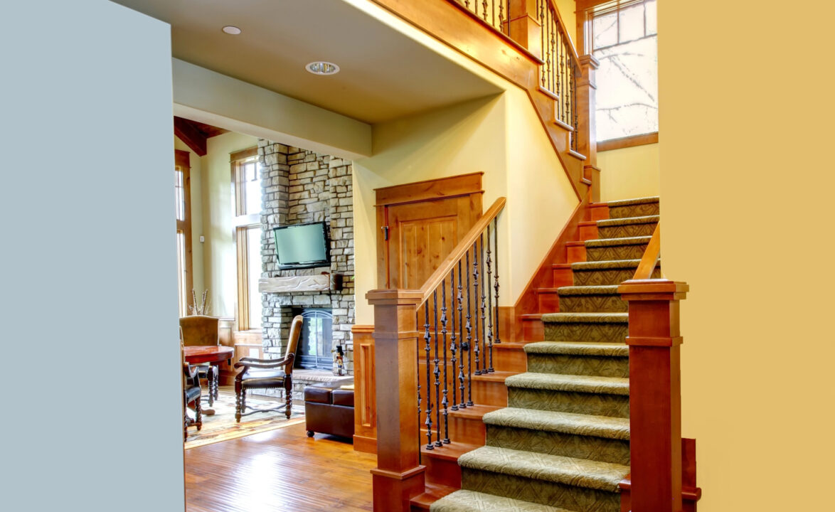 Luxury mountain home hallway with staircase.