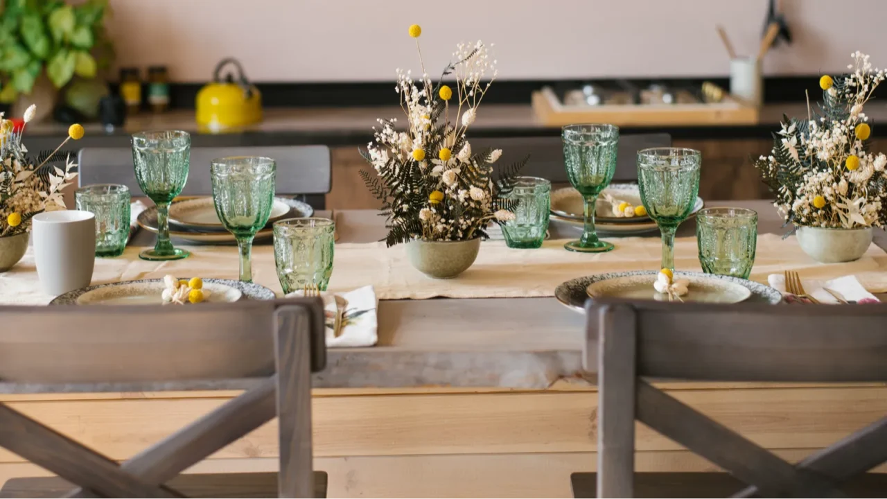 A beautiful festive dining table in the rustic style. Dried flowers in a ceramic vase on the table