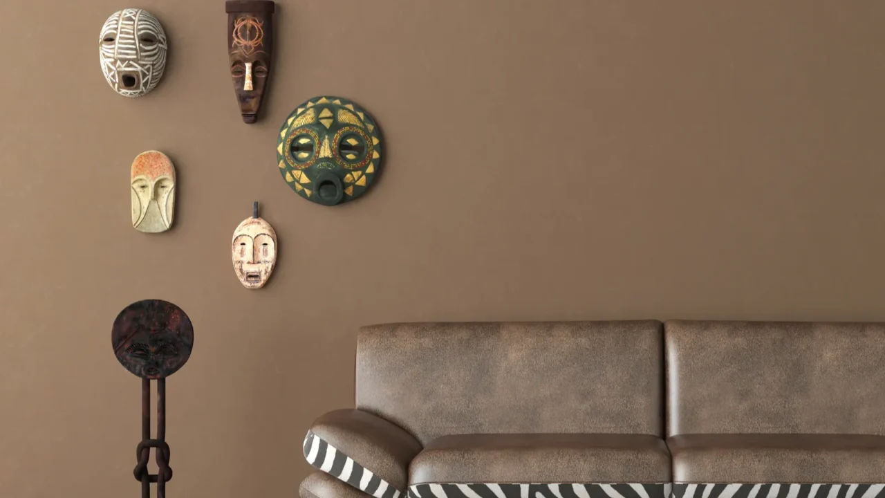 Brown wall with tribal masks and couch