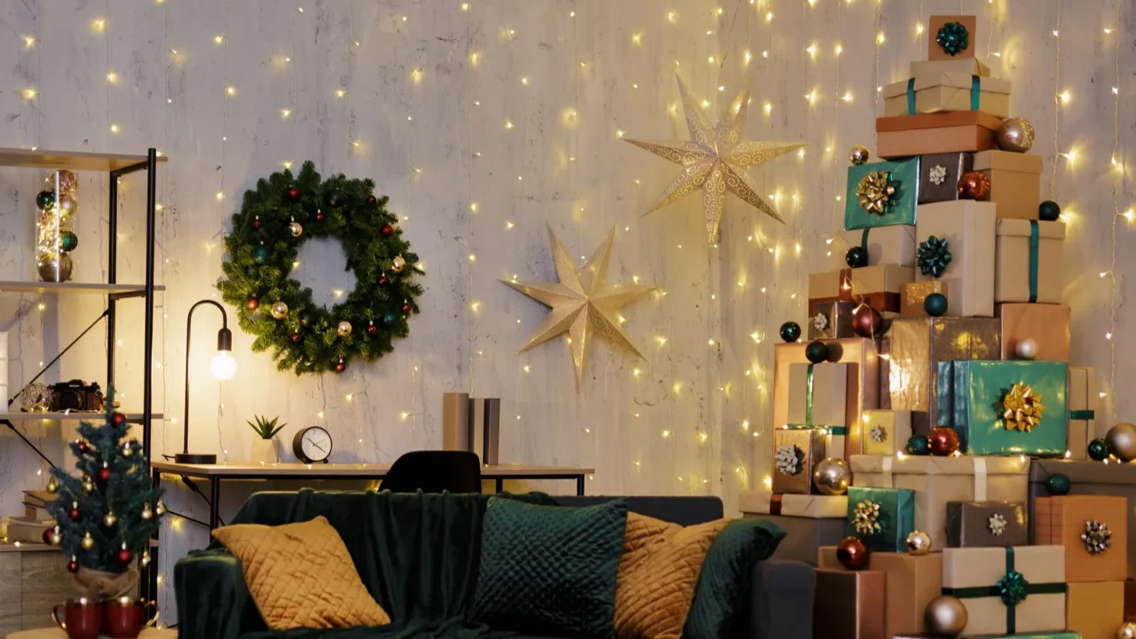 Christmas interior - decorated living room with led lights and tower of gift boxes in shape of christmas tree