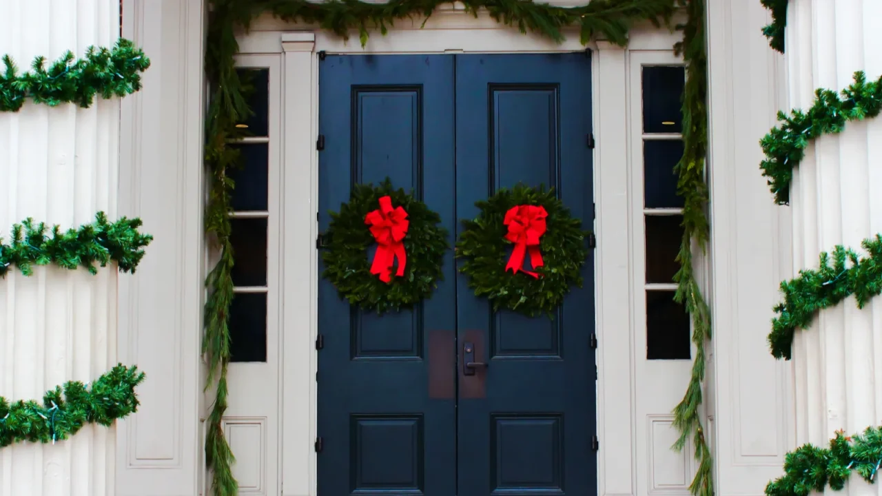 Christmas wreaths on a door and pillars