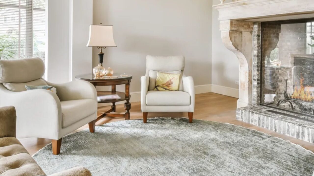 Luxurious living room with white anf neutral color interior - sofa, walls, and curtains, rug.