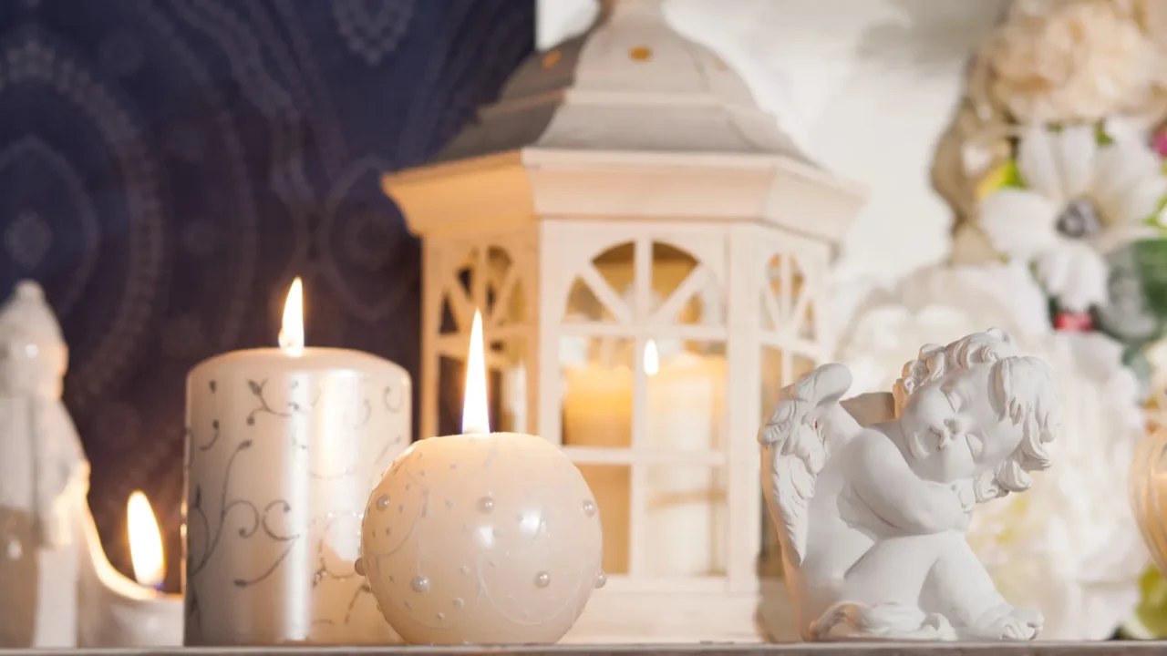 Lantern-candlestick, candles and porcelain angel