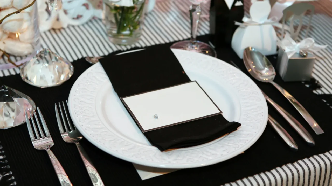 Luxurious dinner in black and white with name tag in the plate