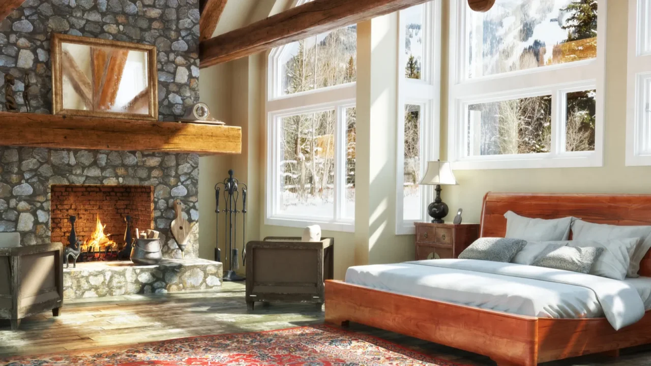 Luxurious open floor cabin interior bedroom design with roaring fireplace and winter scenic background