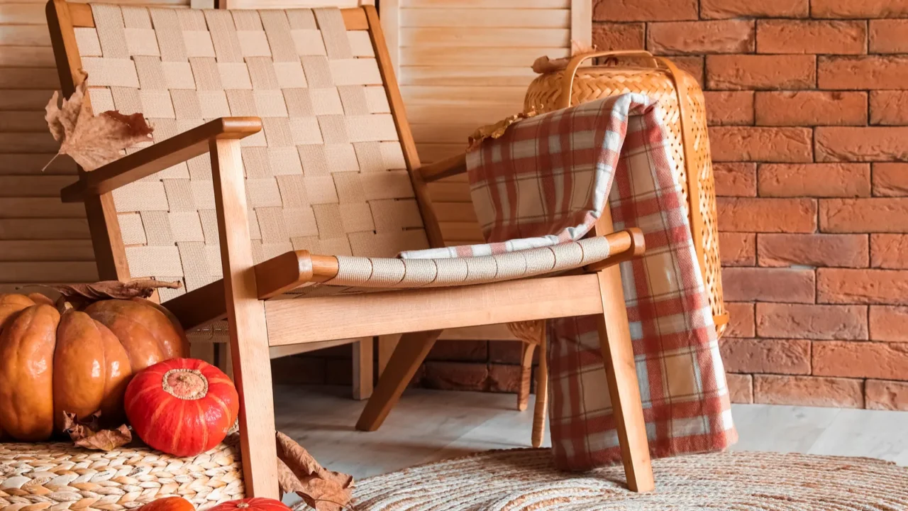 Rattan armchair and pumpkins in interior of modern room