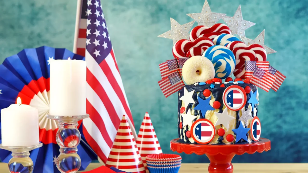 USA theme candyland fantasy drip cake in party table setting.