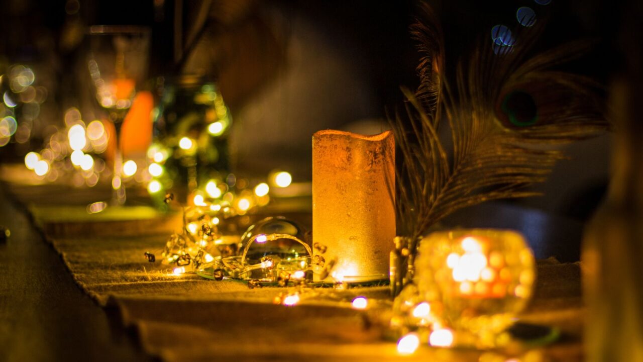 Table decor with string lights and candles.