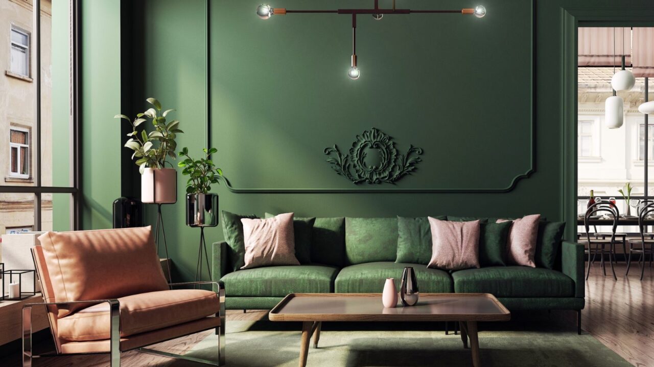 A modern and spacious home. An elegant dark green living room with a comfortable sofa and armchair designed in a classic, vintage and mid-century modern style.