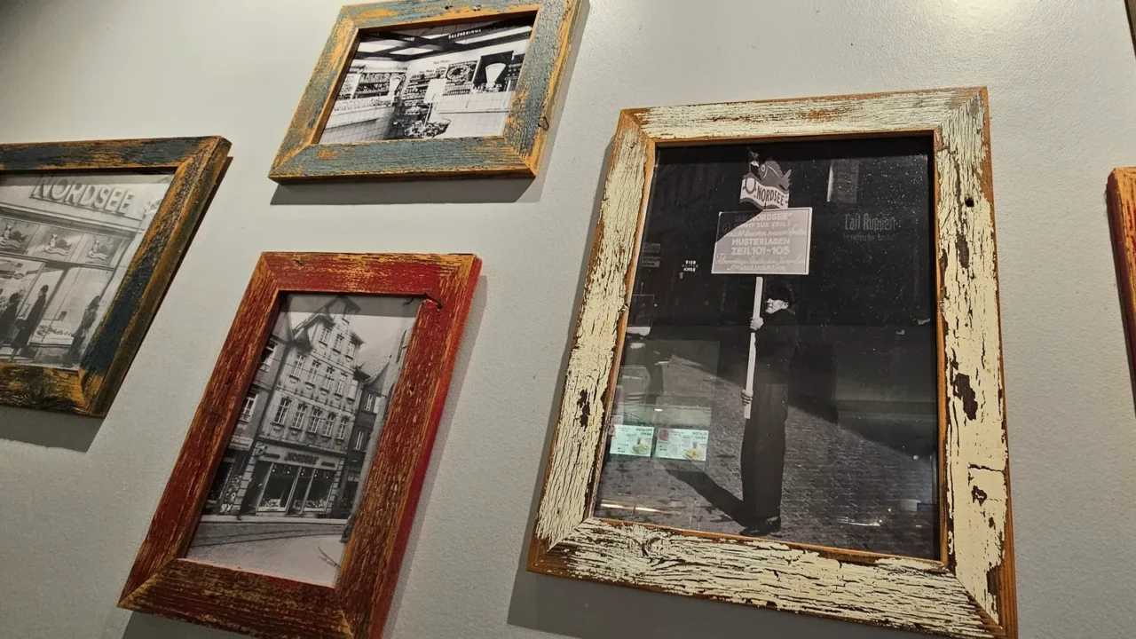 Vintage Storefront Photos in Rustic Frames on a Wall