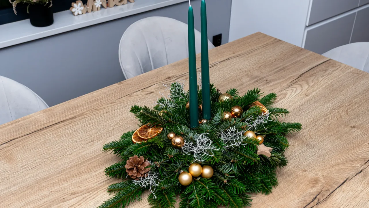 a christmas decoration made of coniferous branches and a piece