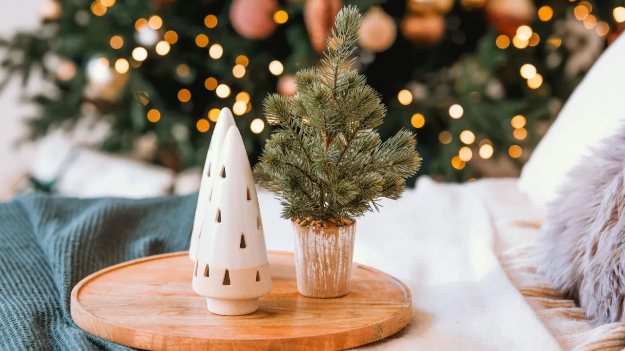 a cozy bedroom features a beautifully decorated christmas tree with