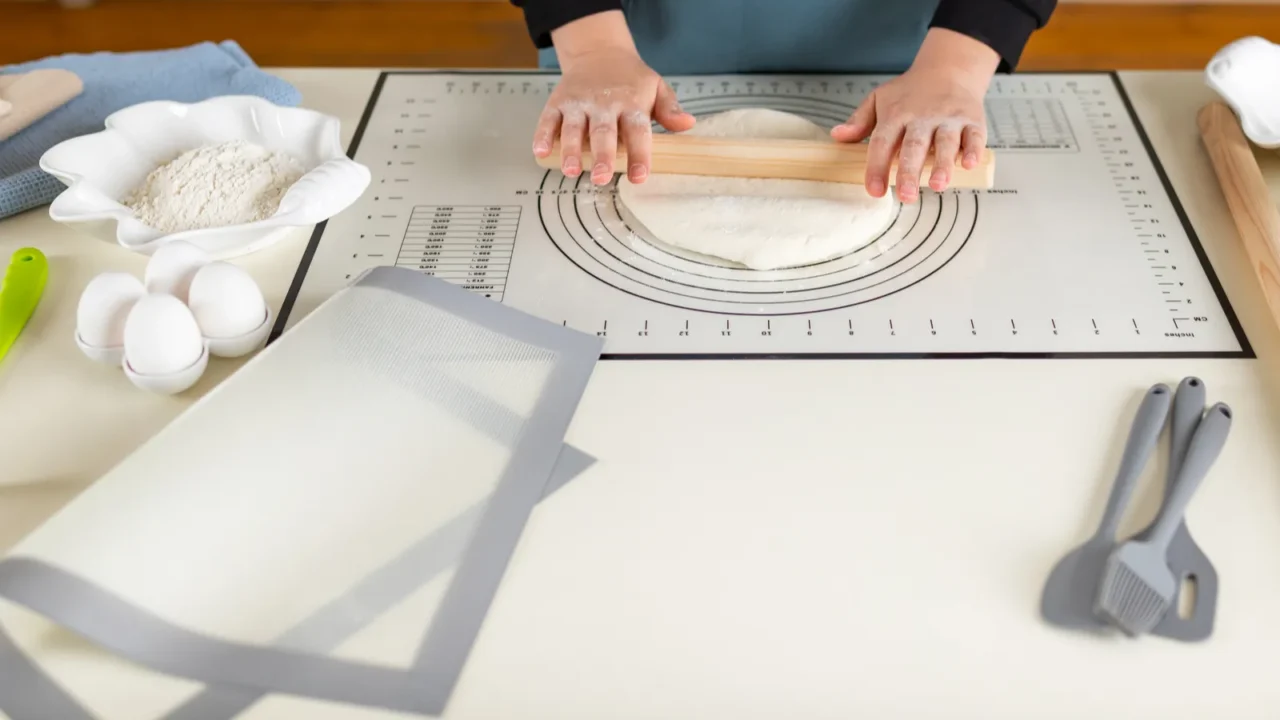 a large kitchen work table on which the chef rolls