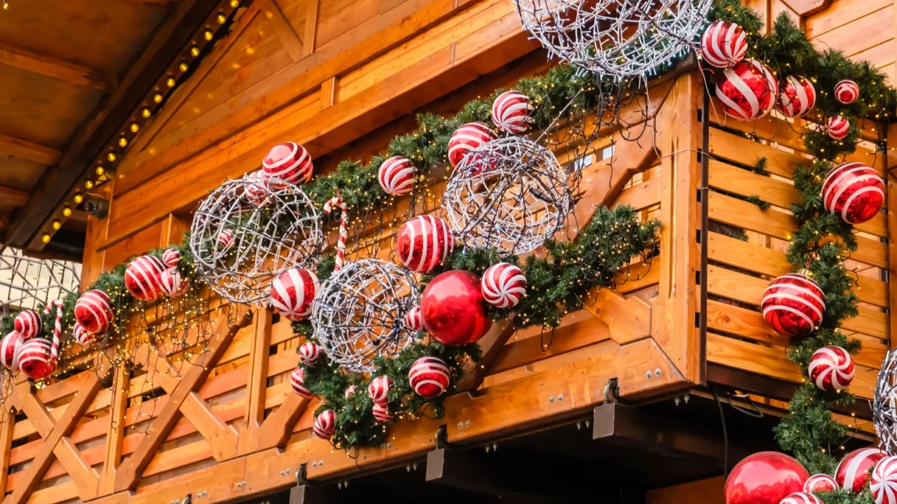 balcony of wooden vintage building decorated of artificial fir tree