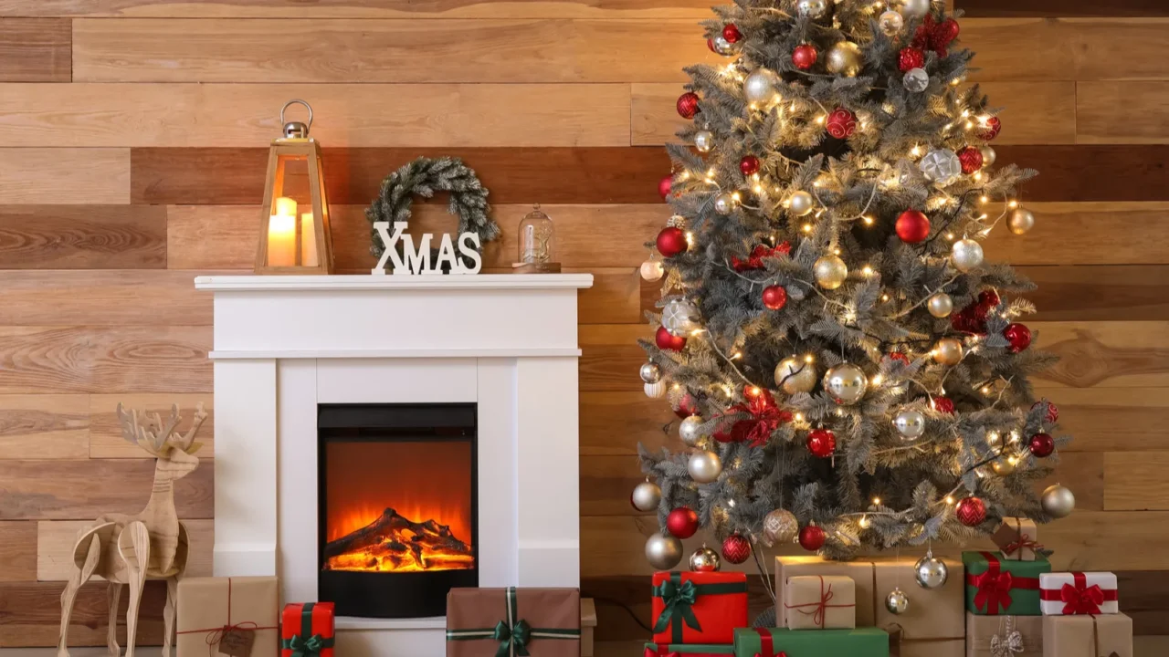 beautiful christmas tree with gifts fireplace and decor near wooden