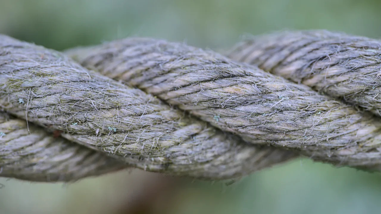 Close up view of old common natural fibers rope. Jute rope.