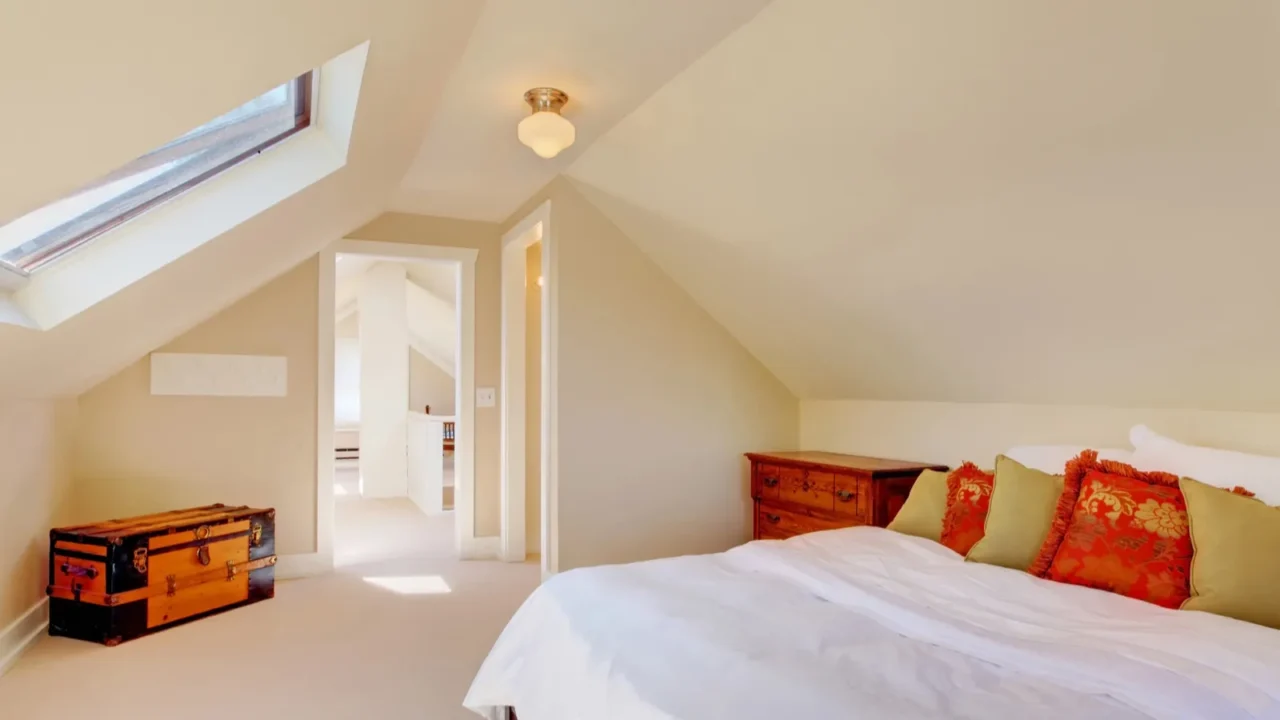 bright clean attic bedroom in the small home