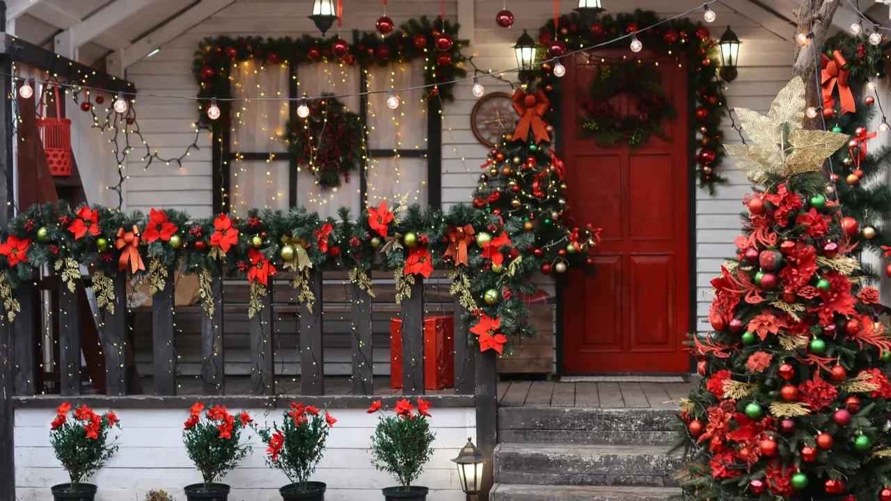 Christmas porch decorated with glowing garlands Christmas decorations Christmas wreath