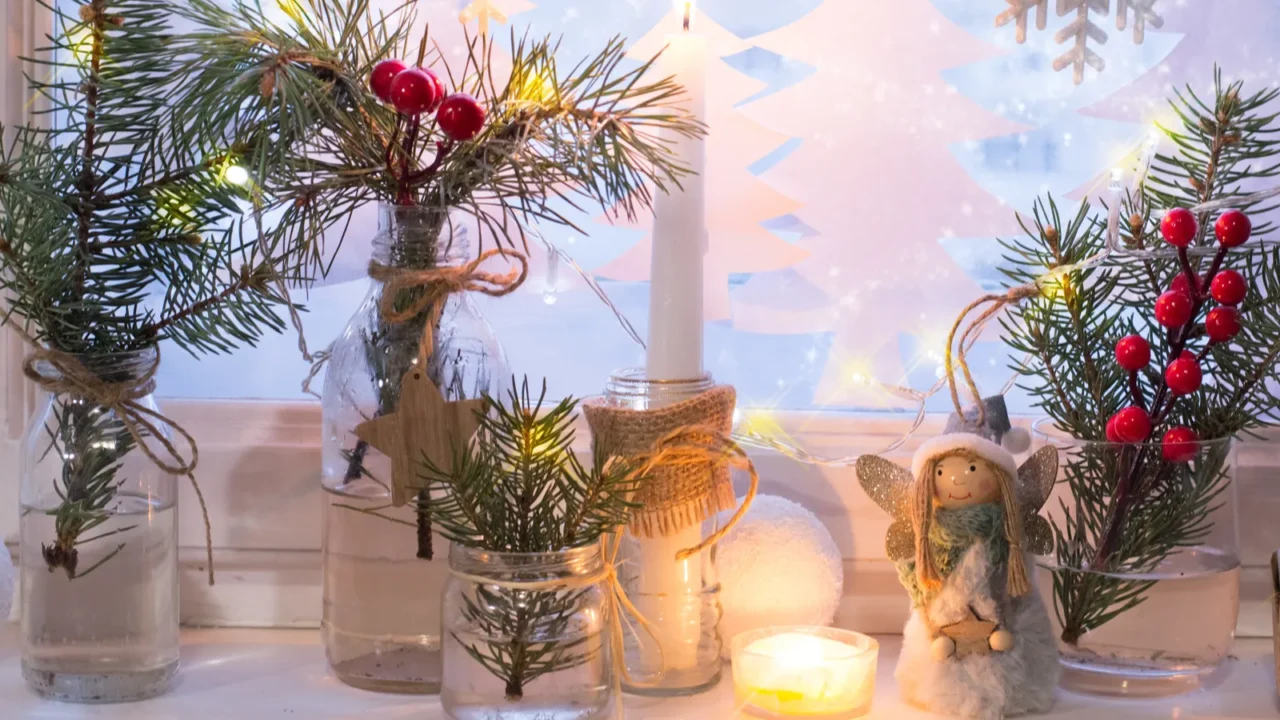 christmas window decoration with ornaments and branches of fir trees