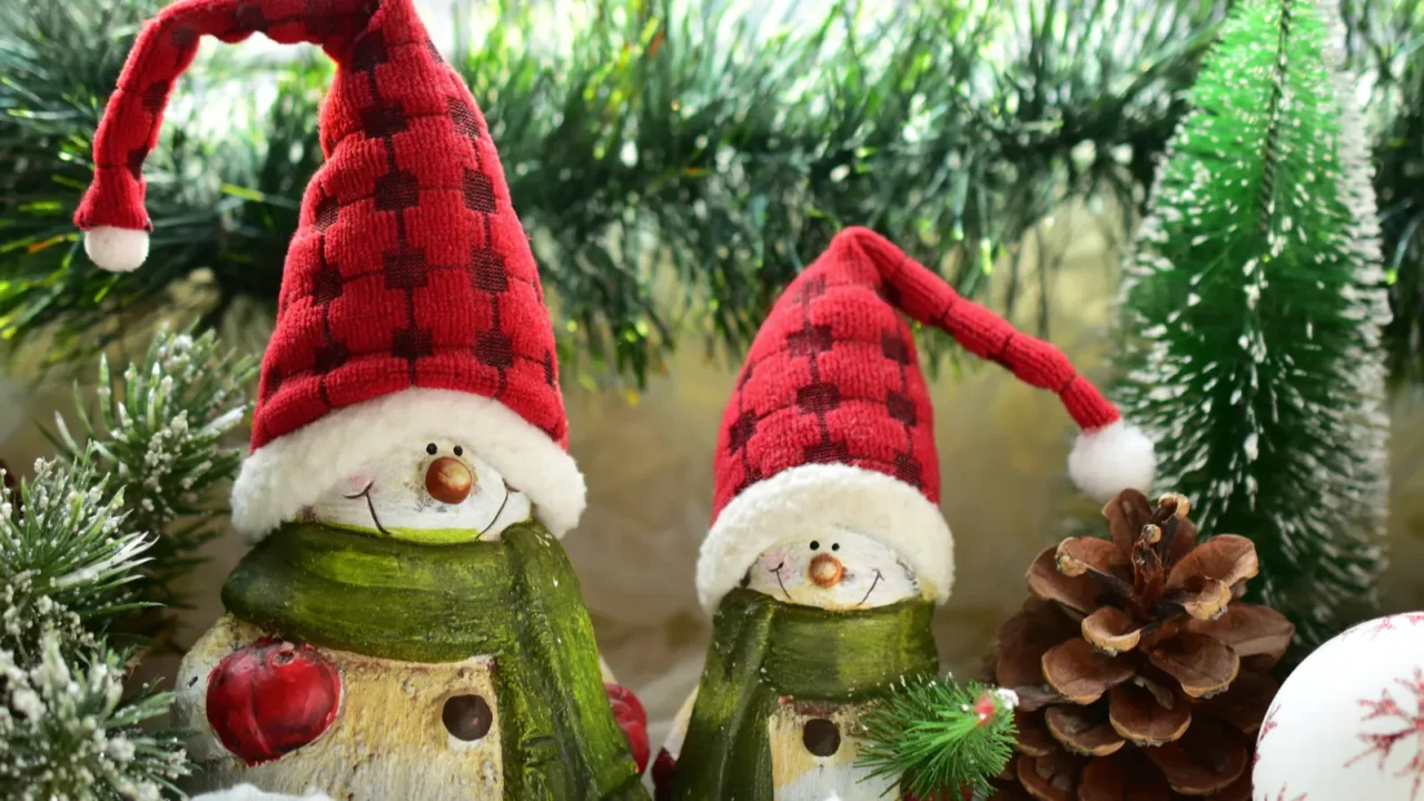 christmas window decoration with snowmen in santa hats