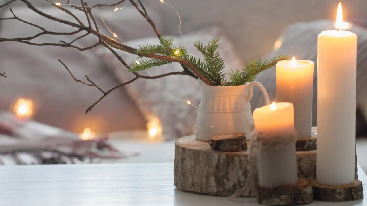 composition of candles on white table against the background