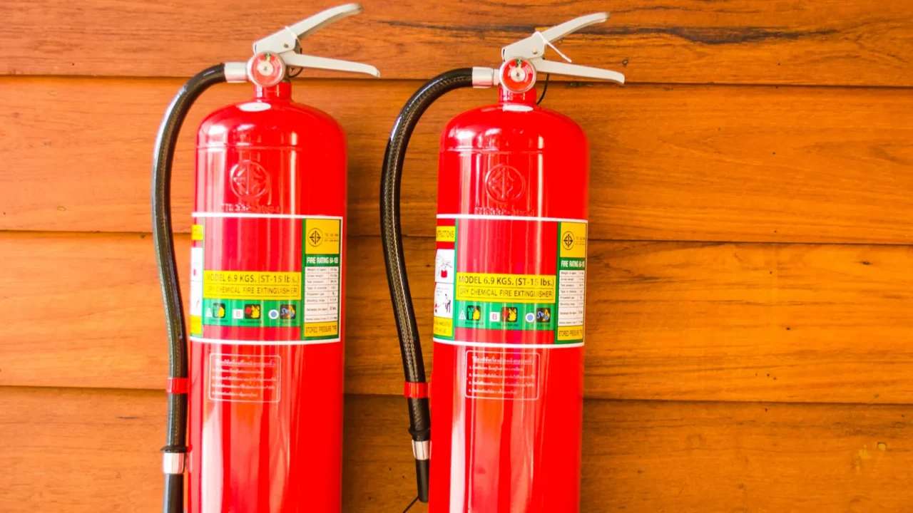 extinguisher on wooden wall