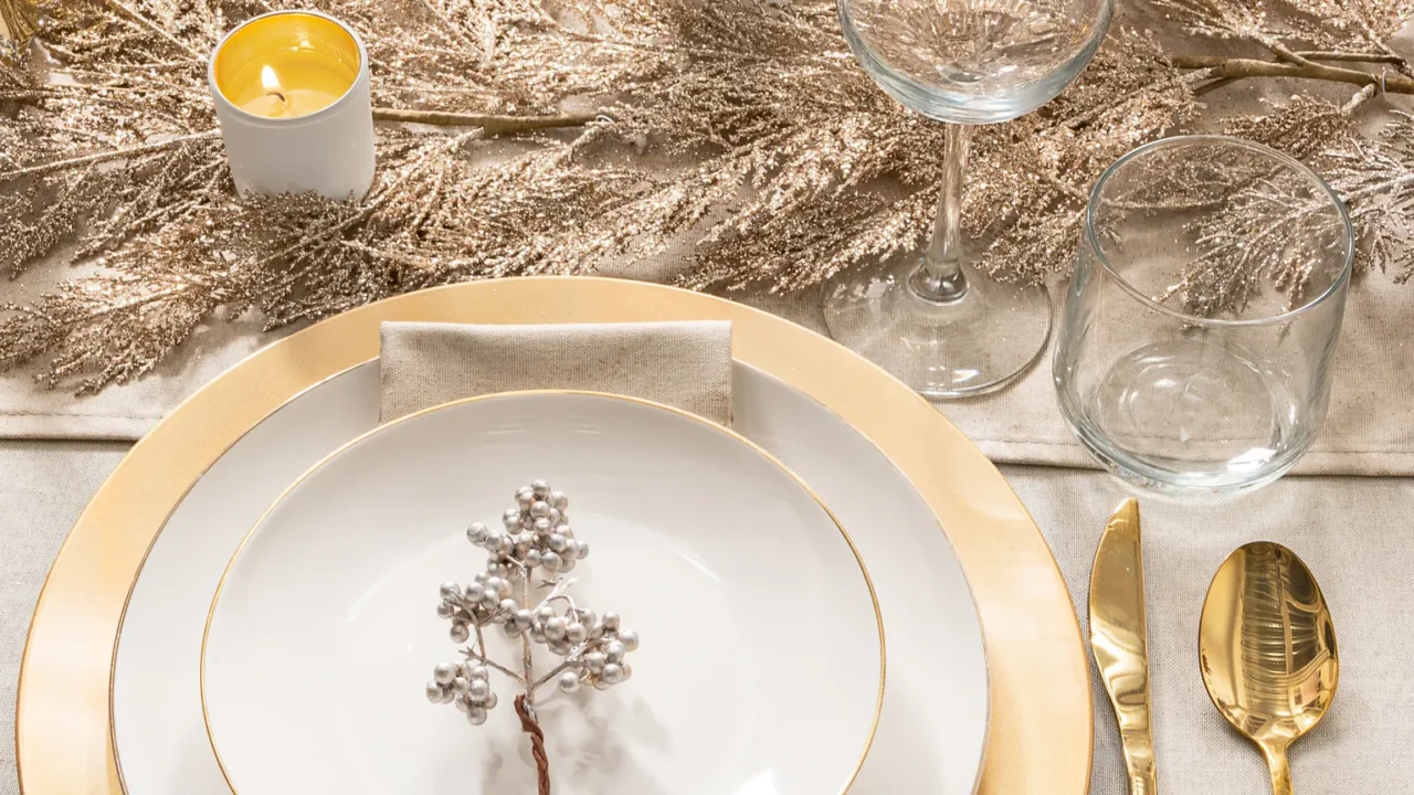 Festive elegance dining table glimmering goldrimmed porcelain plates on golden.