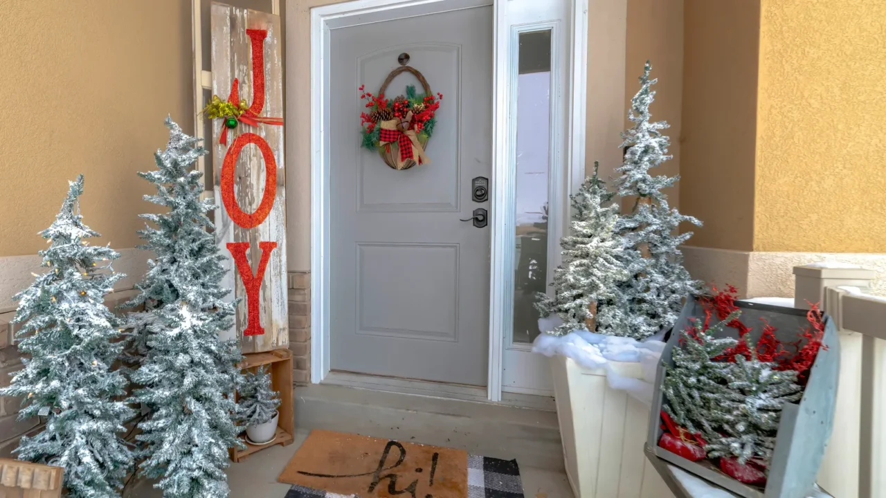 festive home entrance with christmas trees holiday decorations and basket