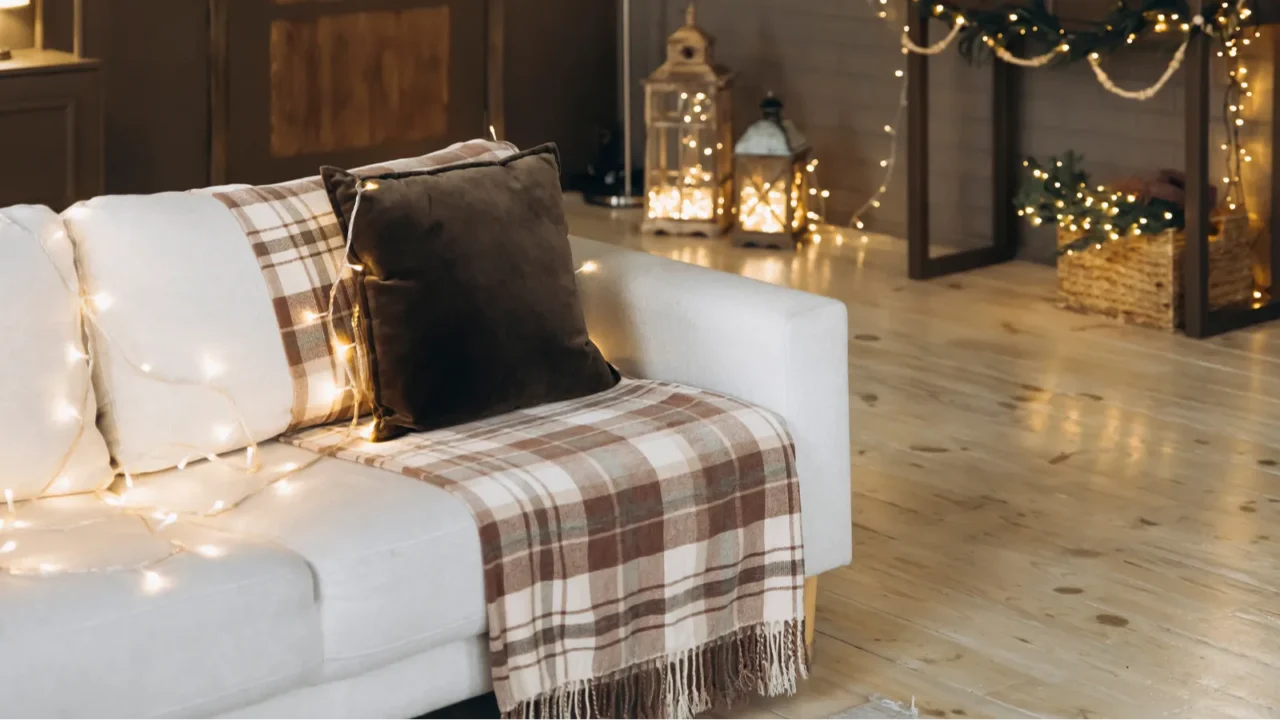 festive living room setup with cozy sofa wrapped in string