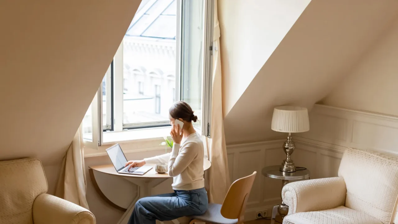 full length view of barefoot woman talking on smartphone near